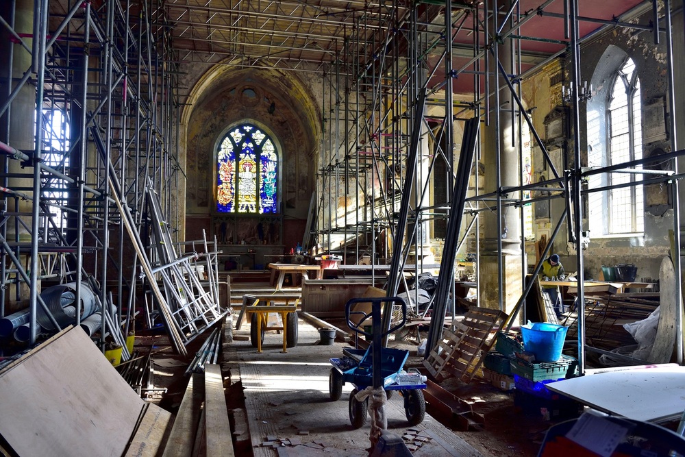 Restoration building site with interior scaffolding and tools in old fire damaged church building being repurposed, England, UK, / Credit: Charles Stirling / Alamy Stock Photo, Alamy Stock Photo 2B045YX Restoration building site with interior scaffolding and tools in old fire damaged church building being repurposed, England, UK,